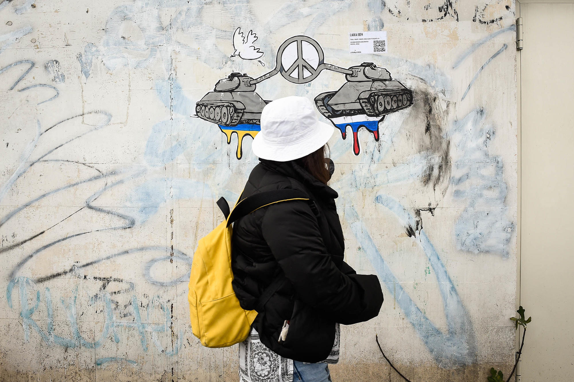 Peace – a mural by street artist Laika. The artist has created two twin posters, posted near the Russian and Ukrainian embassies in Rome.