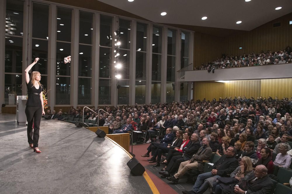 “If I swing my flying pig faster, I need to hold on to the string much tighter,” Professor Heymans says, using her son’s stuffed animal to explain to the crowded Max Kade Auditorium how galaxies are held together.