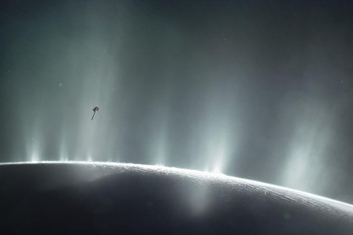 The artist’s impression illustrates the Cassini space probe exploring the ice volcanoes of Enceladus.